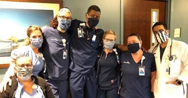medical workers modeling home sewn masks from hope for tampa