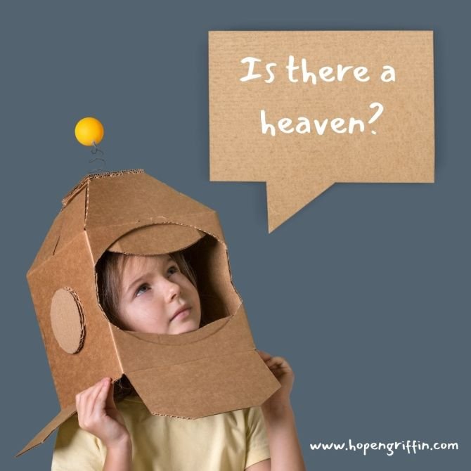 a child with a cardboard box over there head that's been made to look like an astronaut's helmet
the kid is asking "is there a heaven"